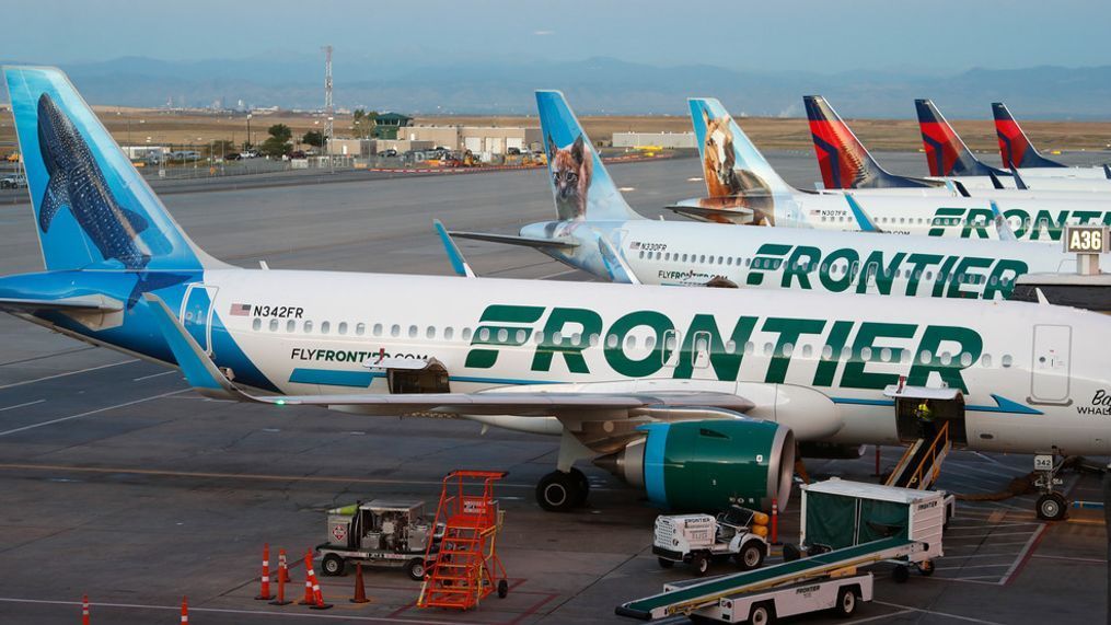 FILE - Frontier Airlines jets sit at gates at Denver International Airport on Sept. 22, 2019, in Denver. (AP Photo/David Zalubowski, File)