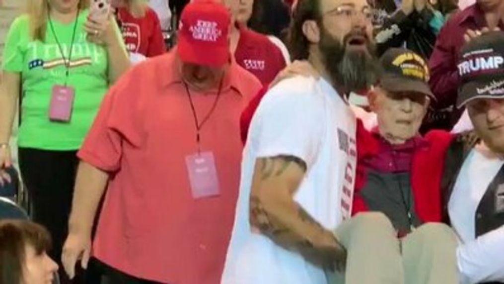 Men carry WWII veteran to his seat at Phoenix Trump rally (Kari Lake/FOX10-Phoenix via Storyful)