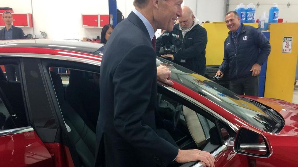 U.S. Sen. Richard Blumenthal, D-Conn., climbs into a Tesla Model 3 at the Consumer Reports Test Track, Tuesday, April 3, 2018, in Colchester, Conn. The senator said he thinks more safeguards should be added to a bill that is before the Senate that would gradually introduce self-driving cars in the U.S. Among other things, he wants cars with autopilot systems like the Tesla, the same model involved in last month's fatal accident, to be included under the bill. (AP Photo/Susan Haigh)