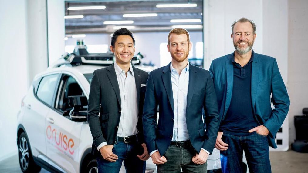 In this Nov. 20, 2018, photo provided by General Motors/Cruise, from left, Cruise Automation's Dan Kan and Kyle Vogt pose for a photo with General Motors' Dan Ammann at Cruise Automation offices in San Francisco, Calif. General Motors’ No. 2 executive is moving from Motor City to Silicon Valley to run the automaker’s self-driving car operations as it attempts to cash in on its bet that robotic vehicles will transform transportation. In a transition announced Thursday, Nov. 29, GM President Ammann will become CEO of the company’s Cruise Automation subsidiary at the beginning of next year. He will replace Cruise co-founder Vogt, who will become chief technology officer. (Noah Berger/General Motors, Cruise via AP)