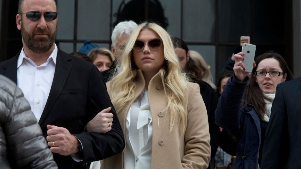 FILE - In this Feb. 19, 2016 file photo, pop star Kesha, center, leaves Supreme court in New York. On Wednesday, April 6, 2016, a New York judge threw out her hate-crime and human-rights claims against her former producer Dr. Luke. Manhattan state Supreme Court Justice Shirley Werner Kornreich said Kesha's claims that Dr. Luke raped and abused her can't go forward because the alleged incidents happened outside New York and beyond the legal time limit.Â? (AP Photo/Mary Altaffer, File)