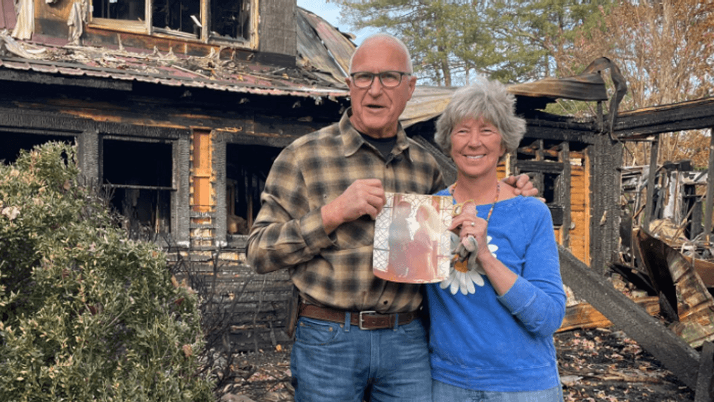 OCT. 25, 2022 - The Farm owners Beverly and Myron Gottfried found one of their wedding photos while looking through the remains of their property after a Saturday fire. (Photo credit: WLOS staff)