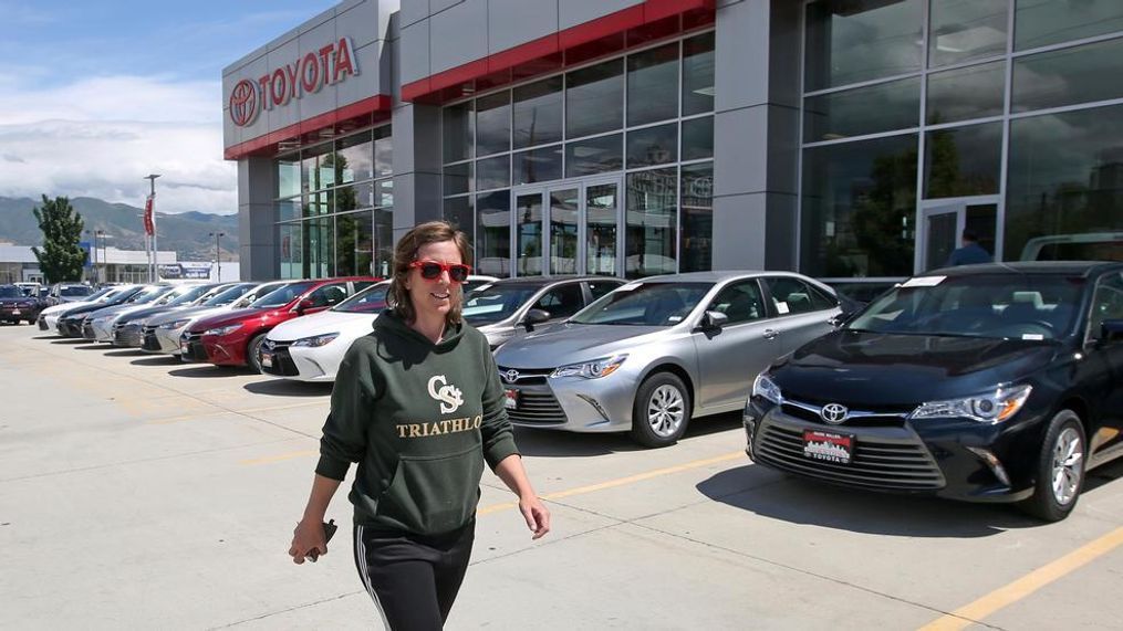 In this Tuesday, June 13, 2017, photo, customer Mary Jean Jones looks for a vehicle at Mark Miller Toyota in Salt Lake City. January 2018 U.S. auto sales are expected to grow just a little as rebates and other deals wane after a December buying spree. (AP Photo/Rick Bowmer)