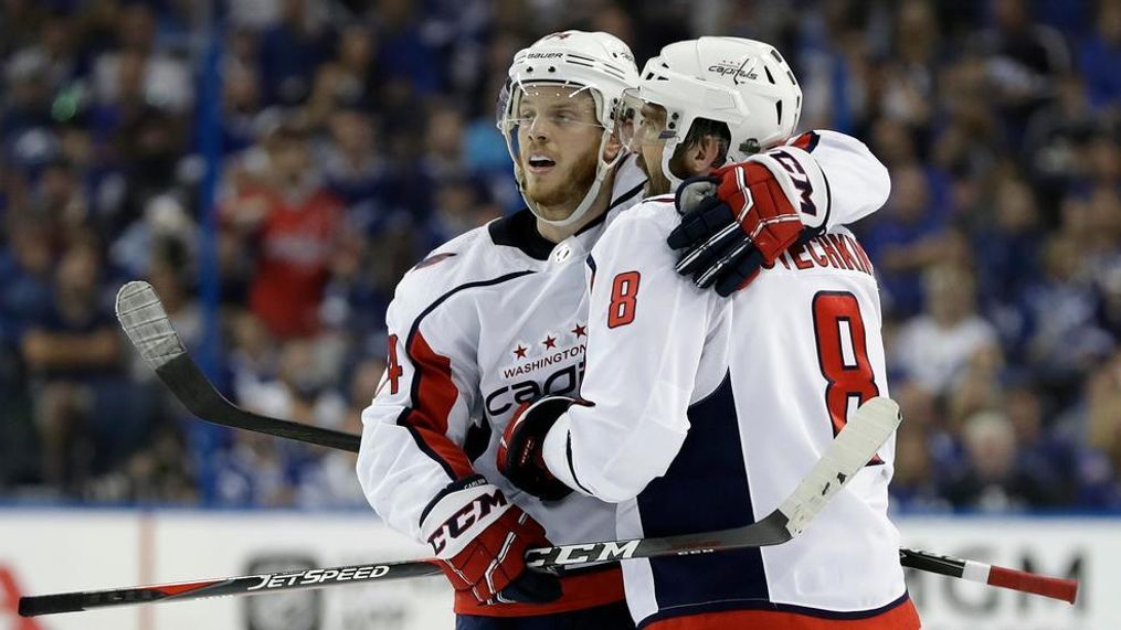 Washington Capitals left wing Alex Ovechkin (8) celebrates with defenseman John Carlson (74) after Ovechkin scored against the Tampa Bay Lightning during the third period of Game 5 of the NHL Eastern Conference finals hockey playoff series Saturday, May 19, 2018, in Tampa, Fla. The Lightning won the game 3-2. (AP Photo/Chris O'Meara)