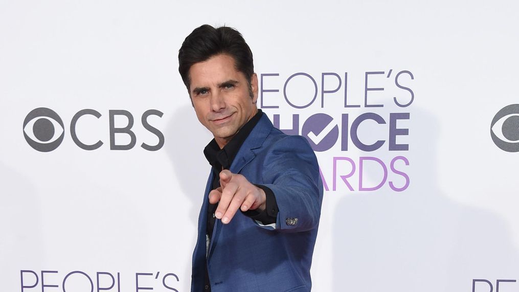 John Stamos arrives at the People's Choice Awards at the Microsoft Theater on Wednesday, Jan. 18, 2017, in Los Angeles. (Photo by Jordan Strauss/Invision/AP)