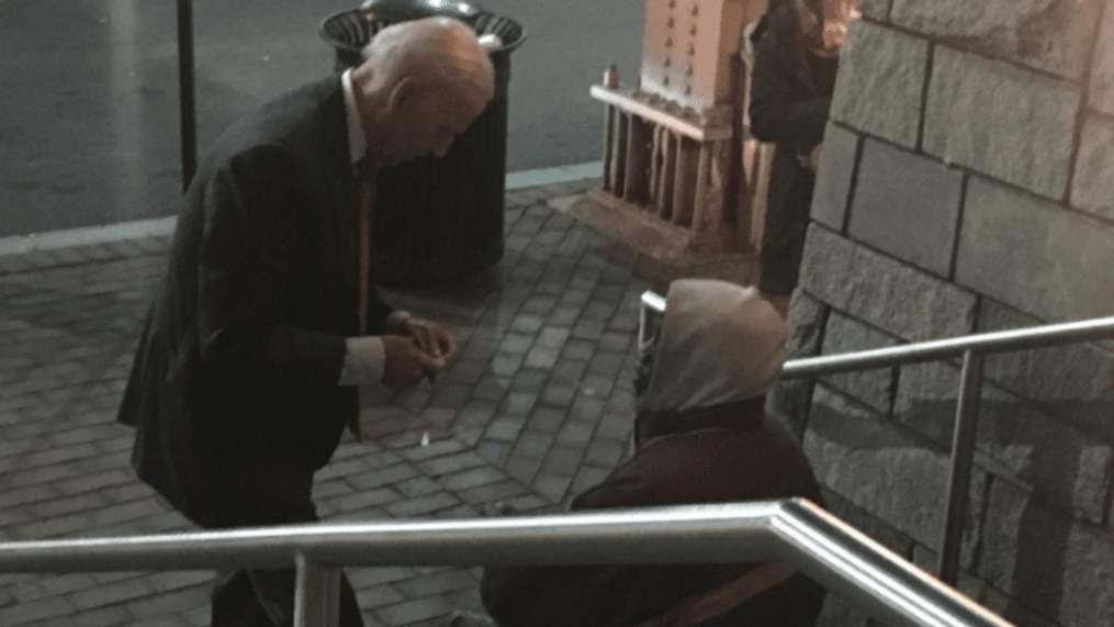 Joe Biden takes time to speak with homeless man outside DC theater, bystander says. (Photo courtesy of bystander Caleb Baca)