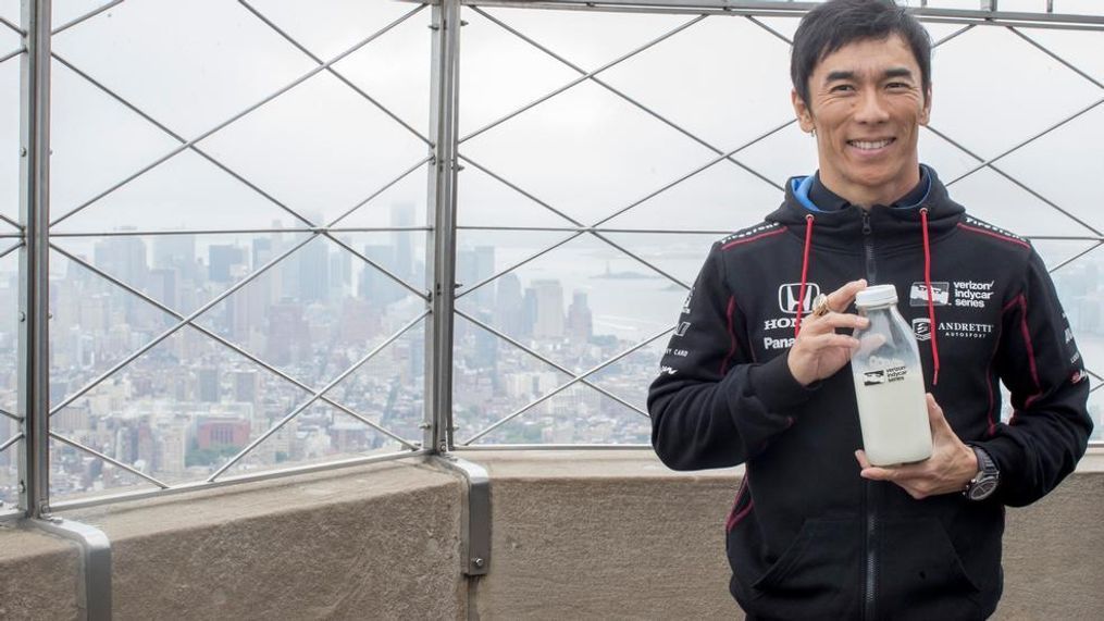 Takuma Sato, winner of the 101st running of the Indianapolis 500, poses for photographers, Tuesday, May 30, 2017, at the Empire State building in New York. (AP Photo/Mary Altaffer)