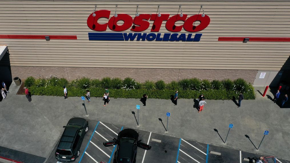 FILE - In this aerial view from a drone, shoppers practice social distancing waiting in line to enter a Costco store on April 13, 2020 in Novato, California. (Photo by Justin Sullivan/Getty Images)