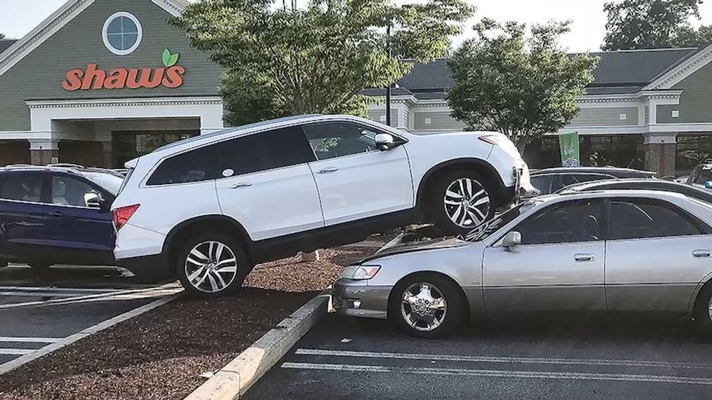 Woman says she crashed her SUV into parked cars because of flip-flops. (Cohasset Police Department via CNN Newsource)