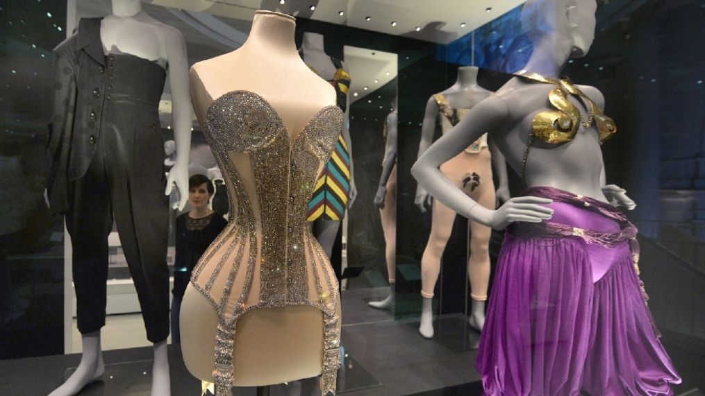 A woman views lingerie on display during the press preview of Undressed: A Brief History of Underwear at the Victoria and Albert museum, in London, Tuesday April 12, 2016.  Think of it as Victoria's (and Albert's) secret. London's Victoria and Albert Museum has peeled back fashion's layers to expose everything from long johns to lingerie in "Undressed," an exhibition tracing the hidden history of underwear. (Anthony Devlin/PA via AP) 