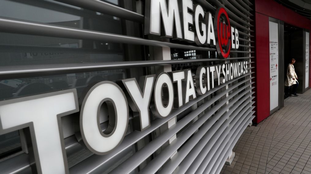 A visitor enters a Toyota Motor Corp.'s showroom in Tokyo, Wednesday, May 10, 2017.  Japanese automaker Toyota says its profit fell 6.6 percent in the fiscal fourth quarter as an unfavorable exchange rate offset better sales. Toyota Motor Corp. reported Wednesday a 398.4 billion yen ($3.5 billion) January-March profit, down from 426.6 billion yen in the same period of the previous year. (AP Photo/Shizuo Kambayashi)