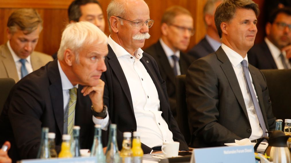 From right to left :  Harald Krueger, CEO of German car maker BMW, Dieter Zetsche, chairman of German car maker Daimler AG and head of Mercedes-Benz cars and Matthias Mueller, CEO of German car maker Volkswagen have taken seat to attend a so-called diesel summit on Wednesday, Aug. 2, 2017 in Berlin. German government officials and automakers meet to discuss the future of diesel vehicles, after a nearly two-year saga of scandal spread from Volkswagen to others in the sector. (Axel Schmidt/Pool Photo via AP)