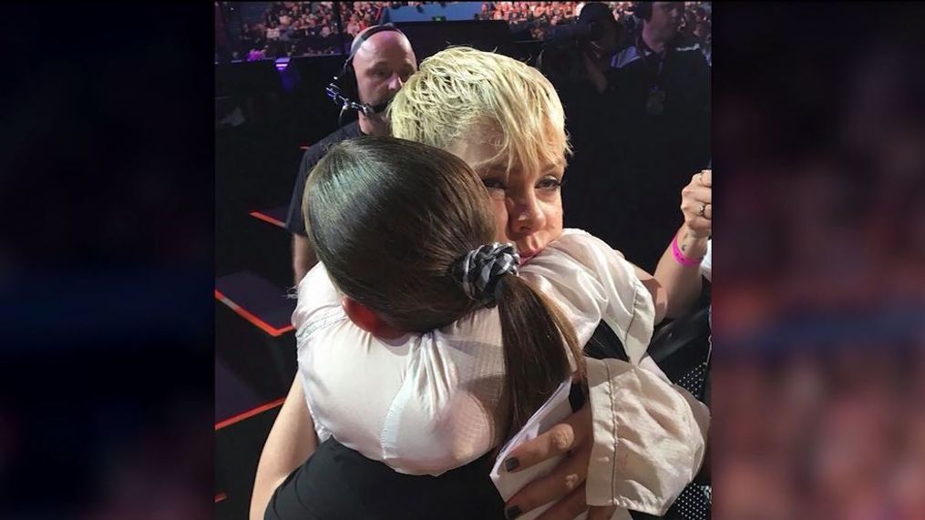 Pink stopped her concert to give a girl who lost her mother in June a hug. (CNN Newsource){p}{/p}