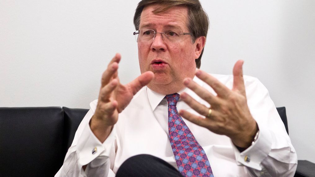 In this Jan. 11, 2016, file photo Toyota North America CEO Jim Lentz speaks during an interview at the North American International Auto Show in Detroit. Lentz told the Detroit Economic Club Wednesday, Dec. 5, 2018, that car sales fell below 30 percent of sales last month, and he thinks that's close to the bottom. (AP Photo/Tony Ding, File)