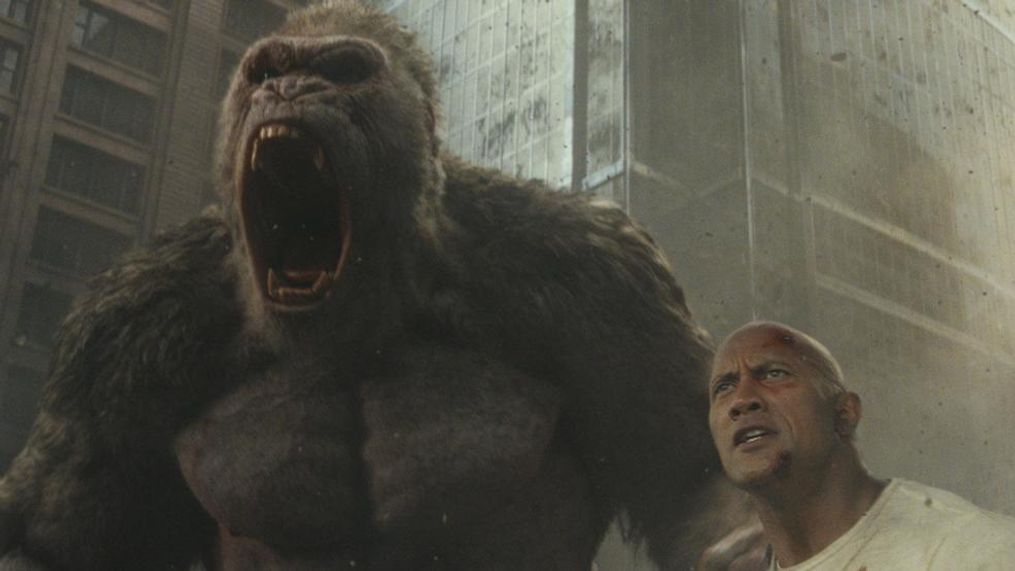 (L-R) JASON LILES as George and DWAYNE JOHNSON as Davis Okoye in New Line Cinema's and ASAP Entertainment's action adventure "RAMPAGE," a Warner Bros. Pictures release. (Photo: Warner Bros.){&nbsp;}