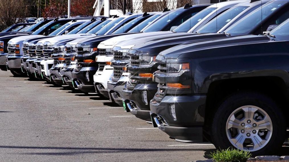 In this Monday, April 24, 2017, photo, Chevrolet Silverado pickups are on display at Quirk Auto Dealers in Manchester, N.H. On Wednesday, Jan. 3, 2018, automakers release U.S. sales data of new cars and trucks in December. (AP Photo/Charles Krupa)