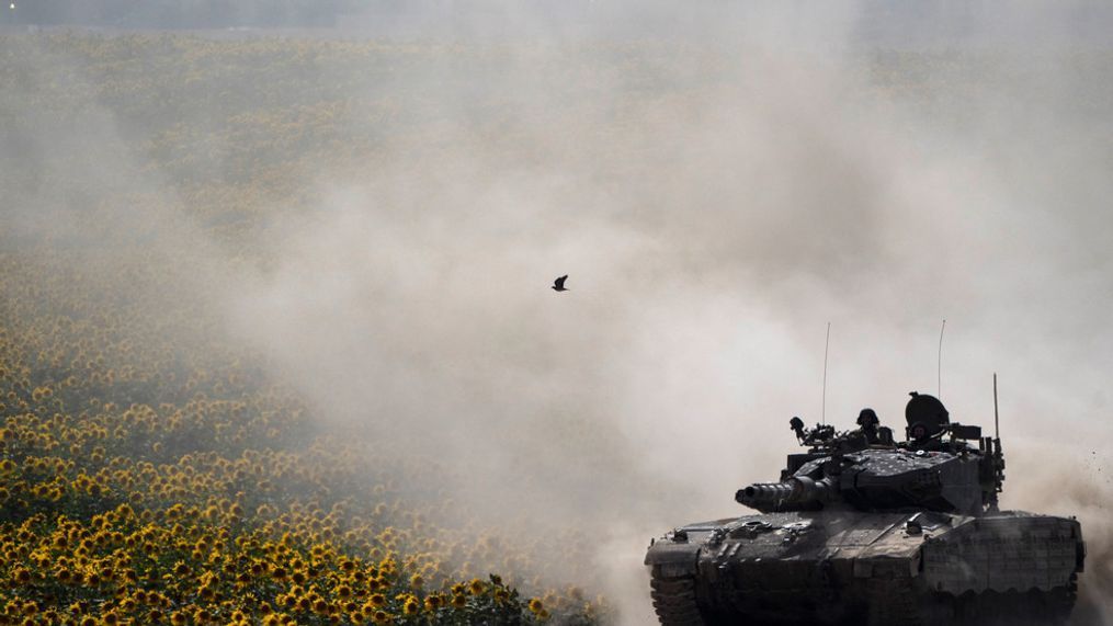 Israeli soldiers move on the top of a tank near the Israeli-Gaza border, as seen from southern Israel, Tuesday, May 28, 2024. (AP Photo/Leo Correa)