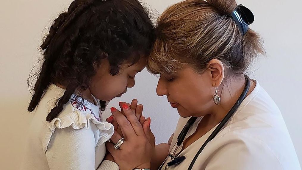 Katherine Ramos, right, with her 4-year-old daughter Victoria Ramos at their home in Patterson, N.Y. Ramos is one of an army of health care workers that heeded New York's call for help reinforcing hospitals overwhelmed by the coronavirus pandemic.{&nbsp;} (James Ramos via AP)