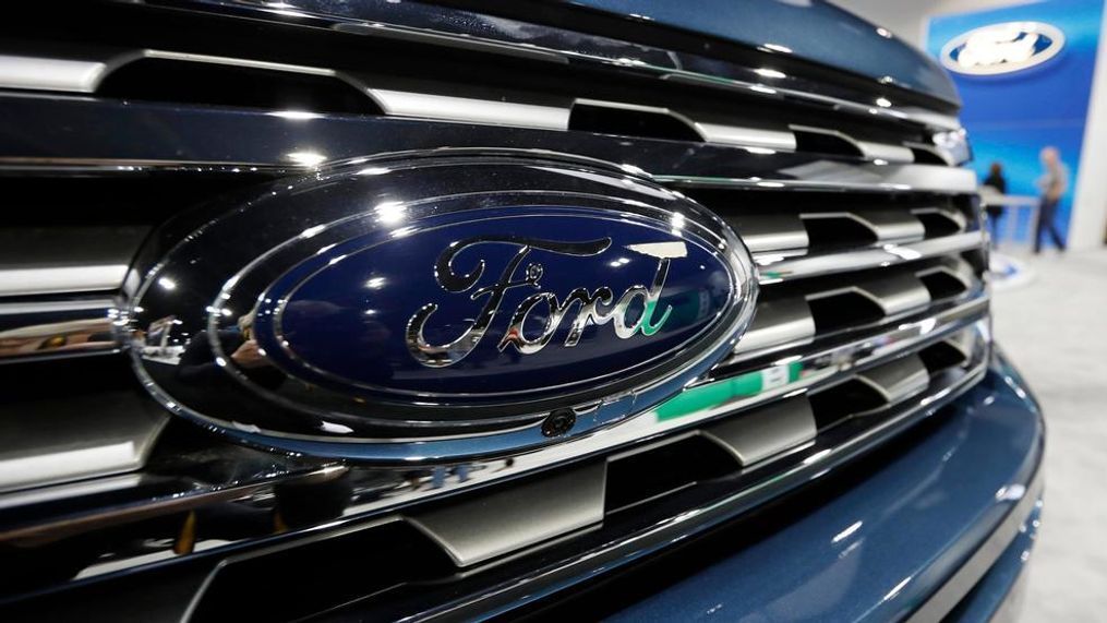 In this file photo dated Thursday, March 28, 2019, the Ford Motor company logo at the auto show in Denver, USA.  Carmaker Ford said Thursday June 27, 2019, it is shedding 12,000 jobs in Europe as it streamlines operations in the region to increase profitability. (AP Photo/David Zalubowski)