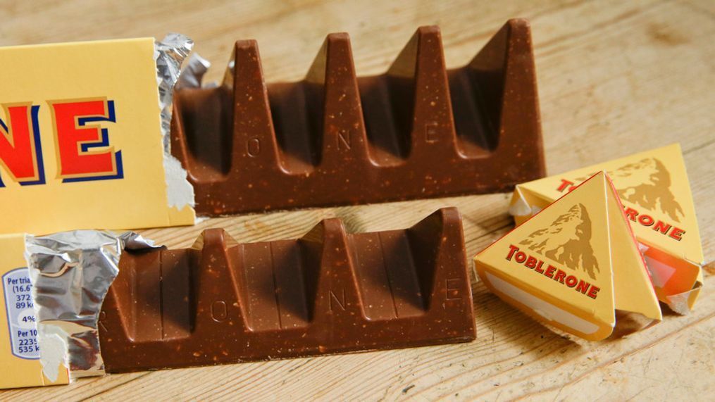 Two bars of the Toblerone Swiss chocolate are shown. At front is the new style 150 gram bar showing the reduction in triangular pieces. In the background is the older style 360 gram bar, pictured in London, on Nov. 8, 2016. (AP Photo/Alastair Grant, File)