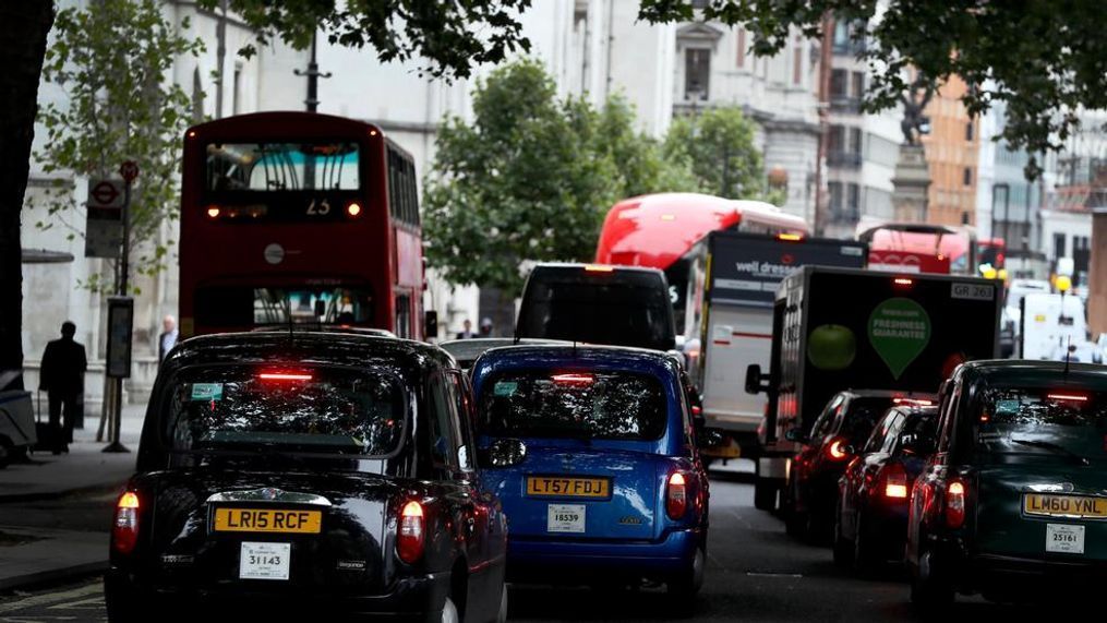 Vehicles drive in central London. To control air pollution, new diesel and petrol cars and vans could be banned in the UK from 2040. (AP Photo/Kirsty Wigglesworth)