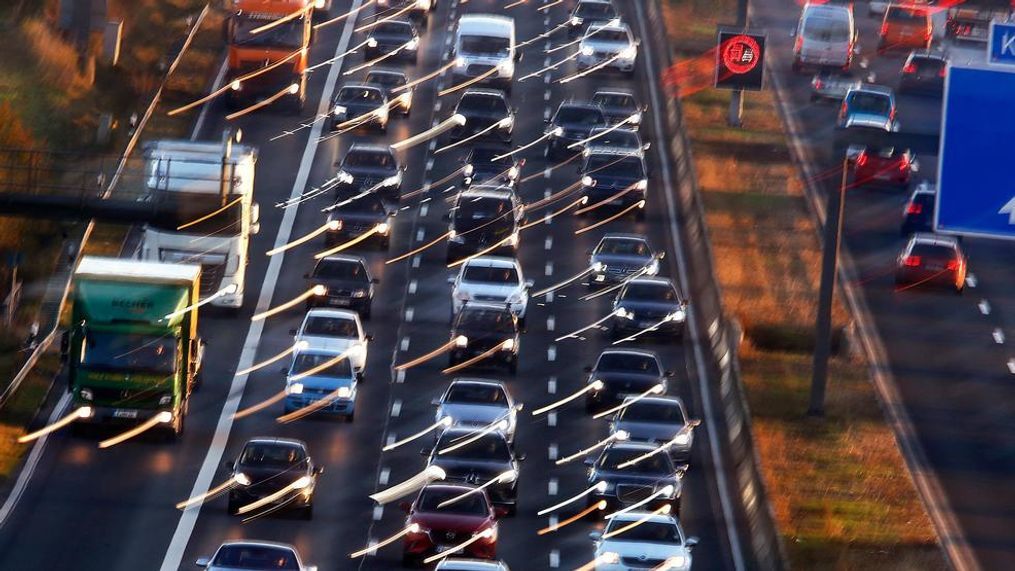 Cars and trucks queue on the highway A5 in Frankfurt, Germany, Monday, Nov. 6, 2017. The World Climate Conference with 25 000 people participating starts on Monday in Bonn, Germany. (AP Photo/Michael Probst)