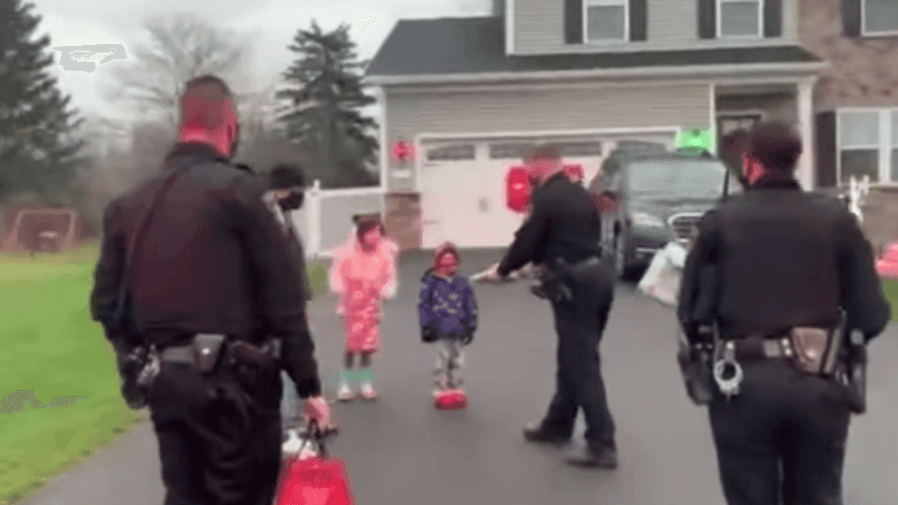 Police officers surprise a boy with leukemia as he returned home from the hospital on Thursday, Dec. 10, 2020. (Courtesy: Onondaga County Sheriff's Office)