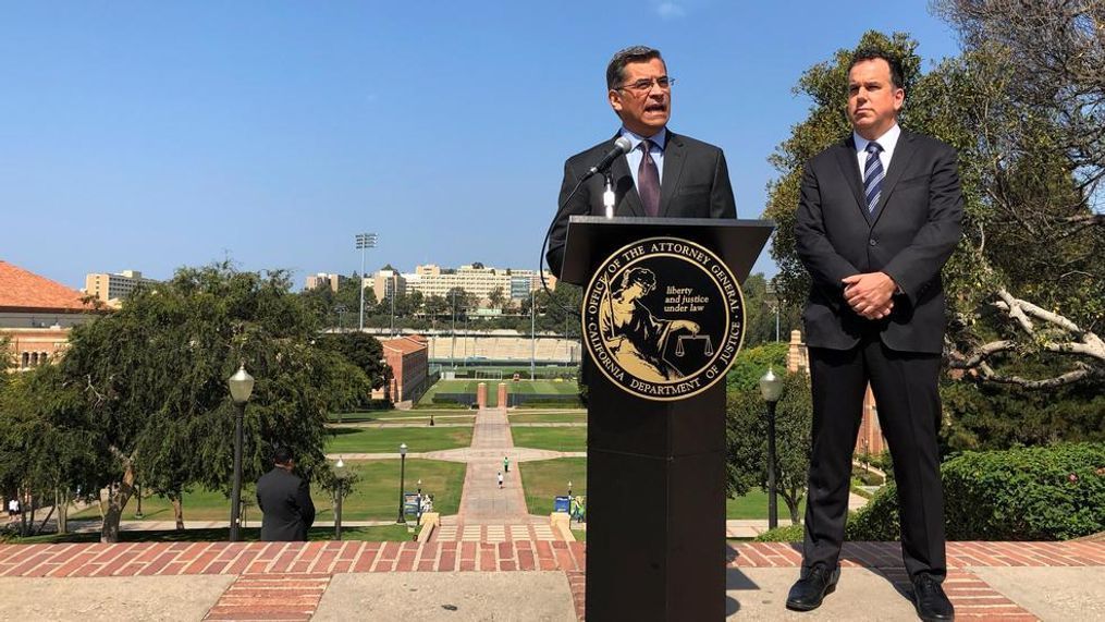 California Attorney General Xavier Becerra speaks at UCLA about his efforts to fight the Trump administration's proposal to weaken car efficiency fuel standards in Los Angeles on Thursday, Aug. 2, 2018. Deputy Attorney General David Zaft is on the right. (AP Photo/Brian Melley)