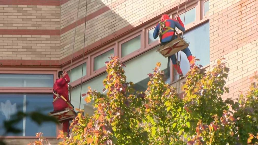 Window cleaners put smiles on children's faces when they dressed up as superheroes to clean the windows at Hasbro Children's Hospital in Rhode Island. (WJAR) 