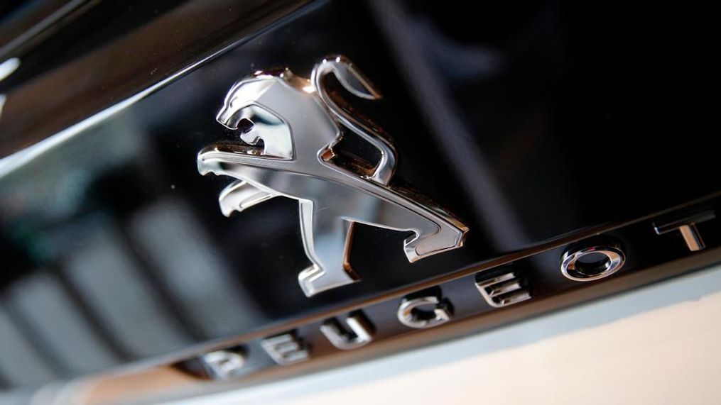 In this Feb. 23, 2017 file photo, the logo of French automaker Peugeot is pictured during the presentation of the company's 2016 full year results, in Paris. PSA Group, the maker of Peugeot and Citroen cars, is doing what General Motors failed to do in 20 years, make the mass market brands Opel Vauxhall profitable, revealing upbeat earnings Tuesday July 15, 2018, for the first six months of the year. (AP Photo/Christophe Ena, File)