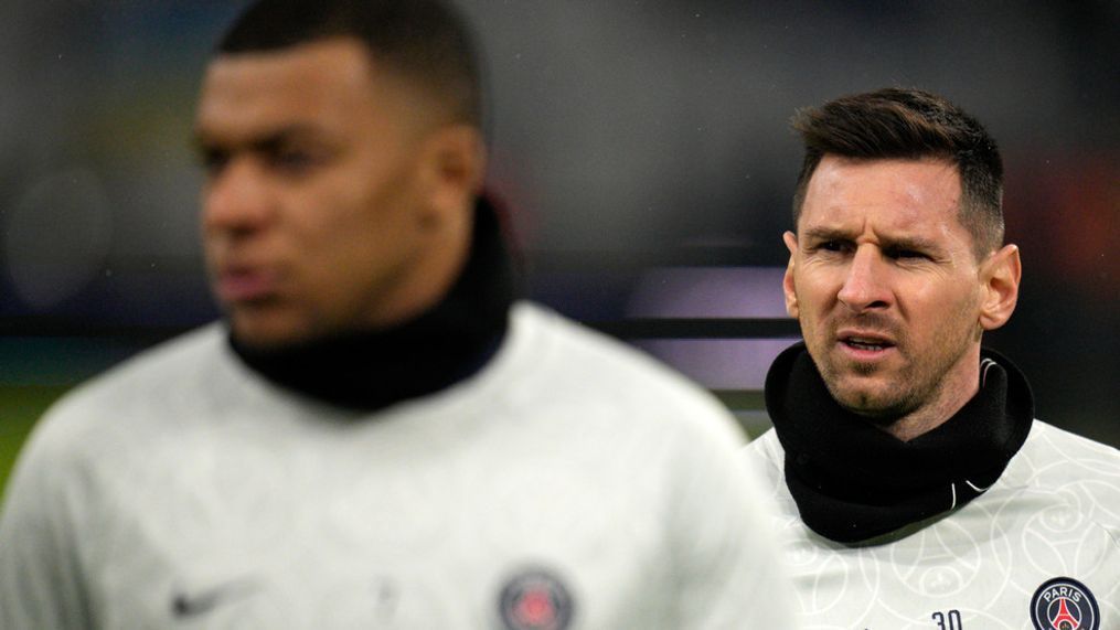 PSG's Lionel Messi, right and PSG's Kylian Mbappe walk during warm up before the French League One soccer match between Marseille and Paris Saint-Germain at the Velodrome stadium in Marseille, southern France, Sunday, Feb. 26, 2023. (AP Photo/Daniel Cole)