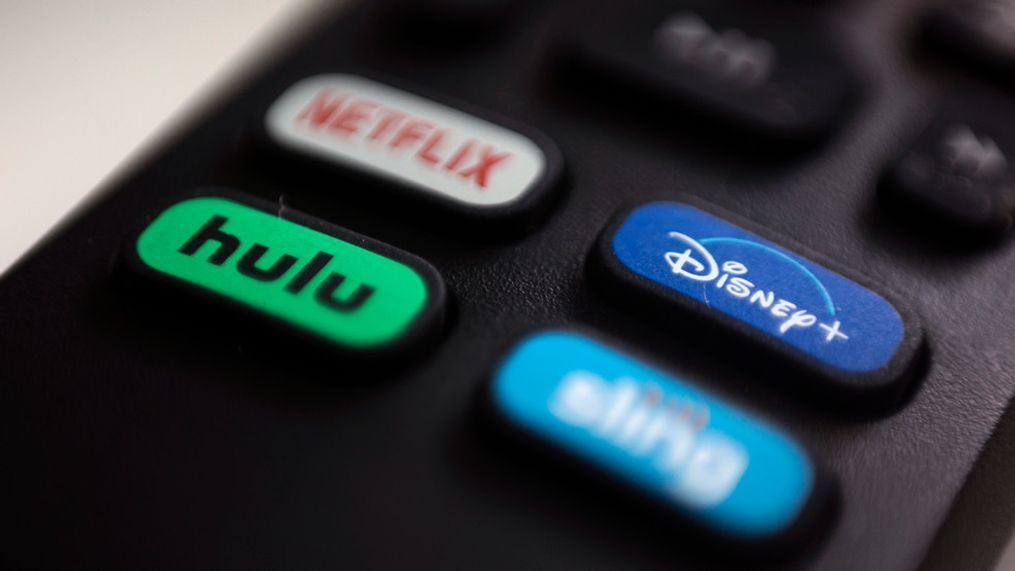 FILE - The logos for streaming services Netflix, Hulu, Disney Plus and Sling TV are pictured on a remote control on Aug. 13, 2020, in Portland, Ore. (AP Photo/Jenny Kane, File)