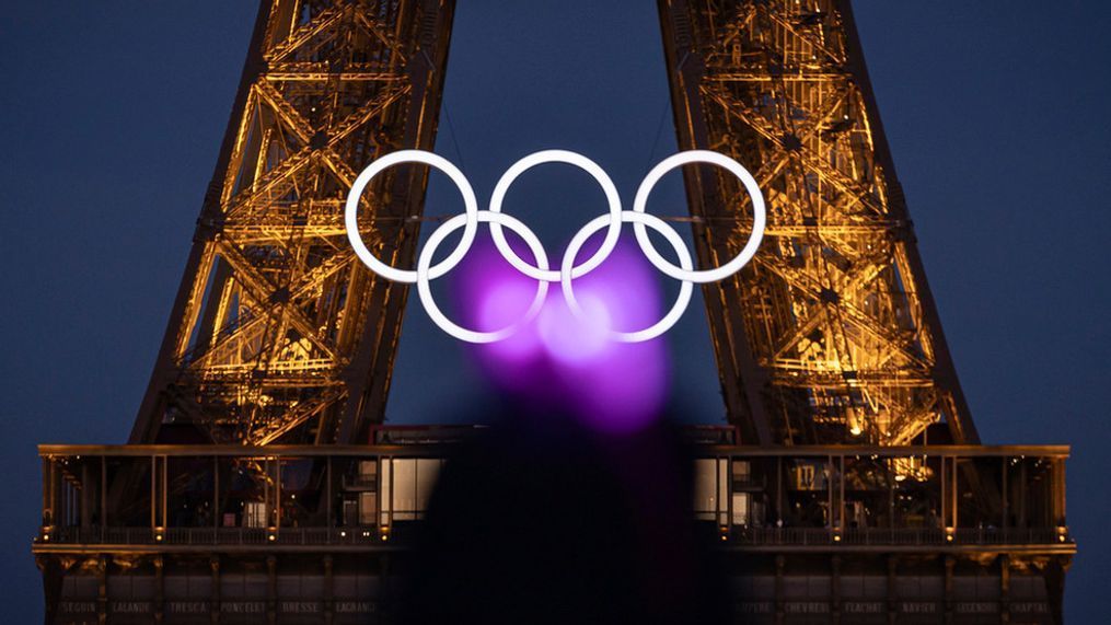 The Olympic rings are seen on the Eiffel Tower Friday, June 7, 2024, in Paris. The Paris Olympics organizers mounted the rings on the Eiffel Tower on Friday as the French capital marks 50 days until the start of the Summer Games. The 95-foot-long and 43-foot-high structure of five rings, made entirely of recycled French steel, will be displayed on the south side of the 135-year-old historic landmark in central Paris, overlooking the Seine River. (AP Photo/Aurelien Morissard)