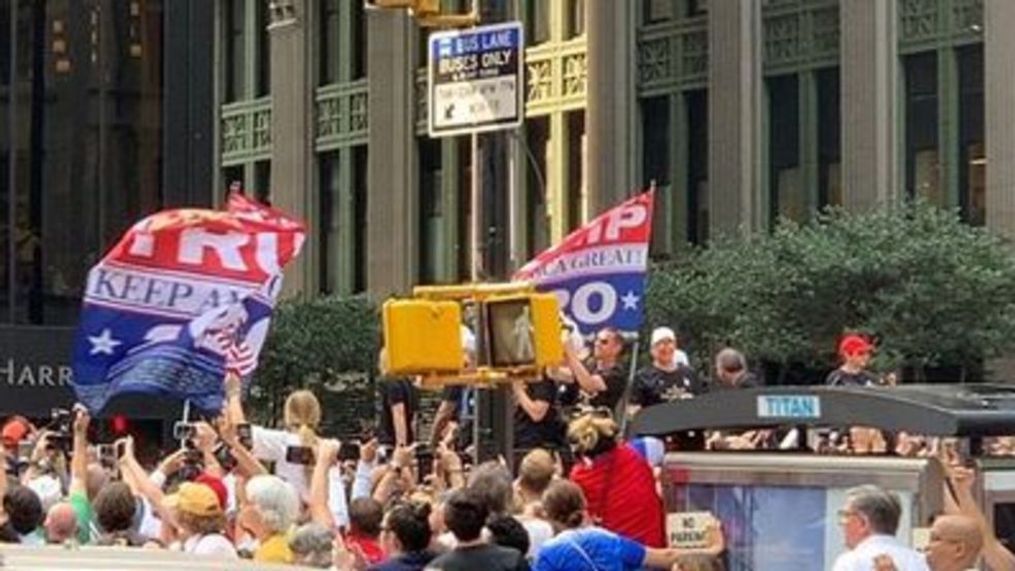  'Trump 2020' flags wave during victory parade for US women's soccer team (Doug Jenks via Storyful)