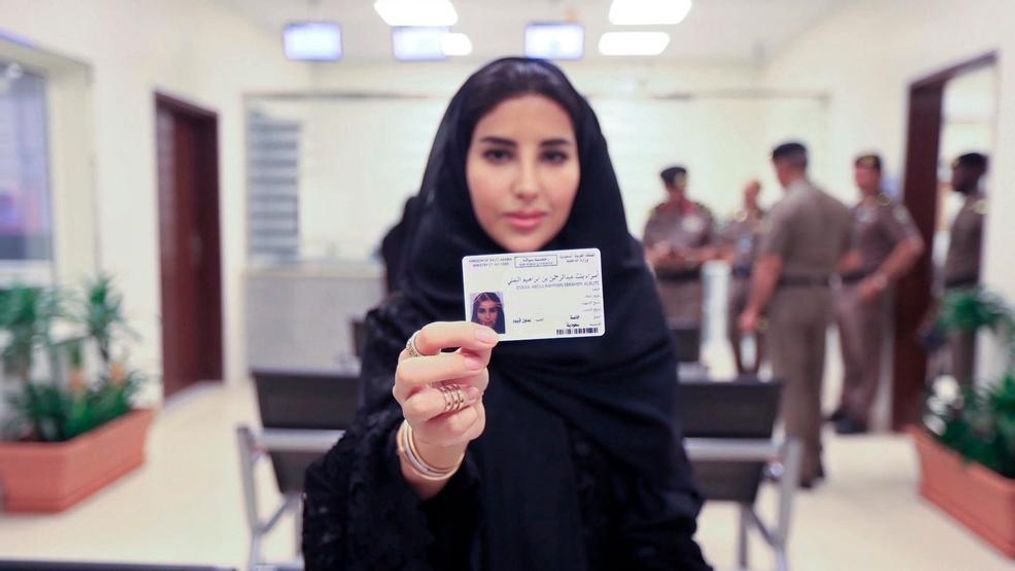 This image released by the Saudi Information Ministry, shows Esraa Albuti, an Executive Director at Ernst & Young, as she displays her brand new driving license, at the General Department of Traffic in the capital, Riyadh, Monday, June 4, 2018. (Photos by Saudi Information Ministry via AP)