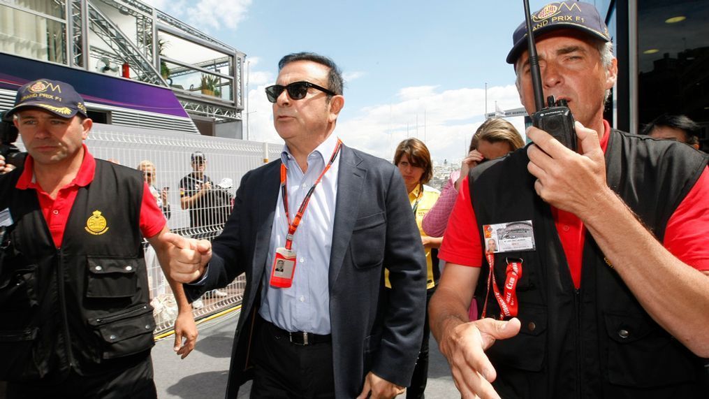 FILE - In this May 24, 2015, file photo, chairman and CEO of Renault-Nissan Carlos Ghosn, center, arrives prior to the start of the Formula One Grand Prix, at the Monaco racetrack. A trailblazer and visionary in the auto industry, Carlos Ghosn is also a highflyer prone to excesses that may have helped bring on his surprise downfall as head of the world’s best-selling auto group. Ghosn was arrested last week in Japan for allegedly falsifying financial reports and misusing funds at Nissan Motor Co. It was a stunning reversal for the industry icon. (AP Photo/Claude Paris, File)