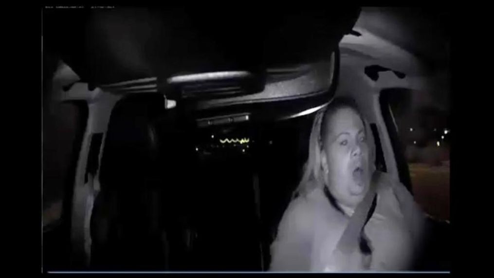 This image made from video Sunday, March 18, 2018, of a mounted camera provided by the Tempe Police Department shows an interior view moments before an Uber SUV hit a woman in Tempe, Ariz. The video shows a human backup driver in the SUV looking down until seconds before the crash. The driver looked up and appeared startled during the last moment of the clip. (Tempe Police Department via AP)