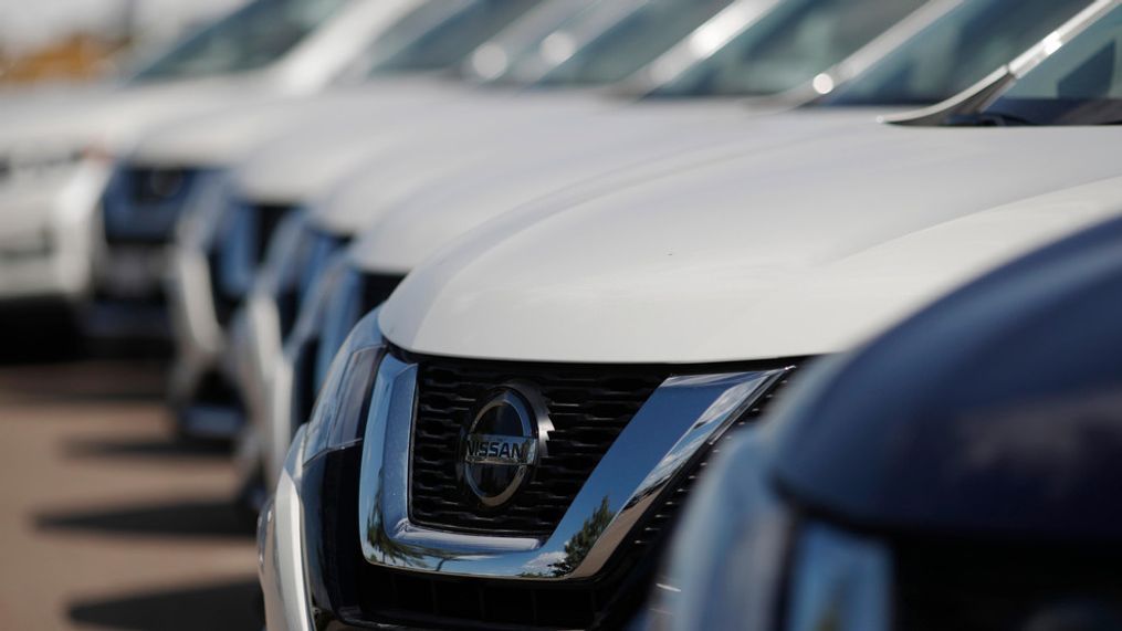 FILE - In this Aug. 25, 2019, file photo, unsold Rogue sports-utility vehicles sit at a Nissan dealership in Highlands Ranch, Colo. The U.S. government’s road safety agency is investigating complaints that the Nissan Rogue’s automatic emergency braking can turn on when no obstacle is in the way. The probe covers about 554,000 Rogue small SUVs from the 2017 and 2018 model years. (AP Photo/David Zalubowski, File)