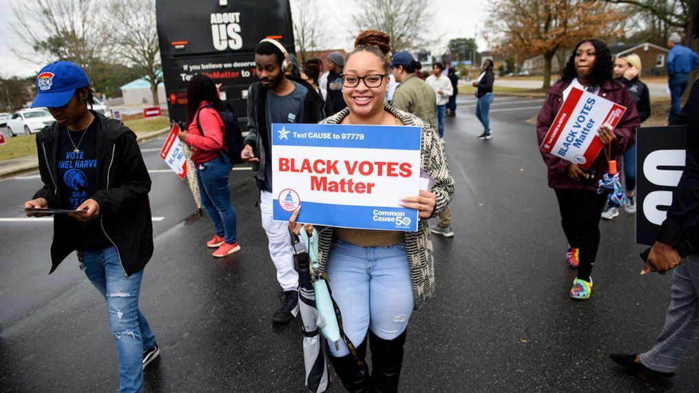 FILE - Fayetteville State University students get off a Black Votes Matter bus at Smith Recreation Center on March 3, 2020 in Fayetteville, North Carolina. (Photo by Melissa Sue Gerrits/Getty Images)