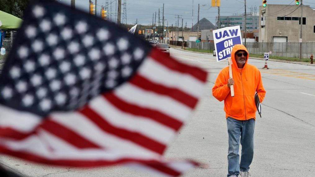 Rocky Perry, a 20-year General Motors employee, pickets outside the GM Fabrication Division, Wednesday, Oct. 16, 2019, in Parma, Ohio. Bargainers for GM and the United Auto Workers reached a tentative contract deal on Wednesday that could end a monthlong strike that brought the company's U.S. factories to a standstill. (AP Photo/Tony Dejak)