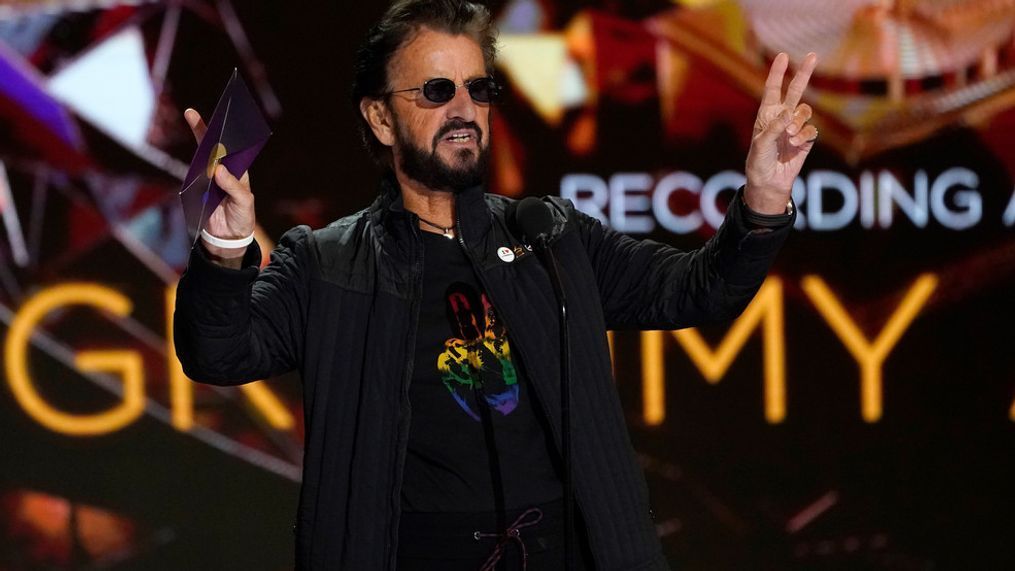 FILE - Ringo Starr gestures as he presents the award for record of the year at the 63rd annual Grammy Awards at the Los Angeles Convention Center on Sunday, March 14, 2021. (AP Photo/Chris Pizzello)