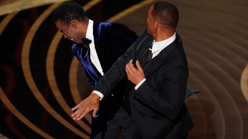 Will Smith, right, slaps Chris Rock onstage during the Oscars ceremony, Sunday, March 27, 2022, at the Dolby Theater in Los Angeles. (Photo AP/Chris Pizzello)