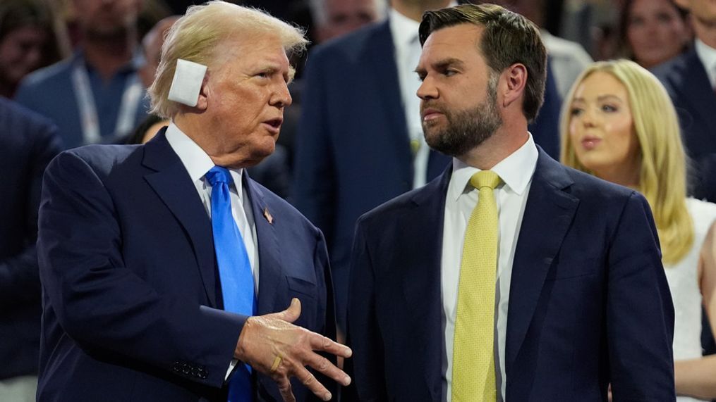 Republican presidential candidate former President Donald Trump is introduced during the Republican National Convention Tuesday, July 16, 2024, in Milwaukee. At right is Republican vice presidential candidate Sen. JD Vance, R-Ohio. (AP Photo/Paul Sancya)