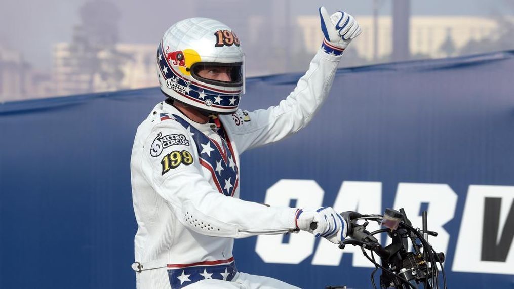 Travis Pastrana salutes the crowd after jumping his motorcycle over 52 cars as he attempts to make three of Evel Knievel's historic jumps Sunday, July 8, 2018, in Las Vegas. Pastrana successfully completed all three jumps, the cars, 16 buses and the Caesars Palace fountains, in three hours. CREDIT: Sam Morris/Las Vegas News Bureau