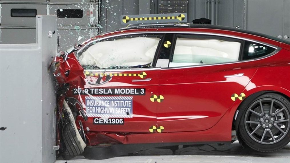 Action shot taken of the 2019 Tesla Model 3 during the driver-side small overlap frontal crash test. (Image courtesy of the Insurance Institute for Highway Safety)