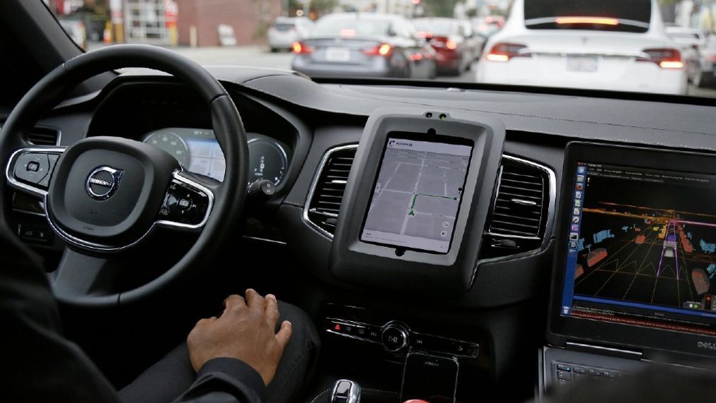 In this photo taken Tuesday, Dec. 13, 2016, an Uber driverless car waits in traffic during a test drive in San Francisco. Uber is bringing a small number of self-driving cars to its ride-hailing service in San Francisco - a move likely to both excite the city’s tech-savvy population and spark a conflict with California regulators. The Wednesday, Dec. 14, launch in Uber’s hometown expands a public pilot program the company started in Pittsburgh in September. (AP Photo/Eric Risberg)