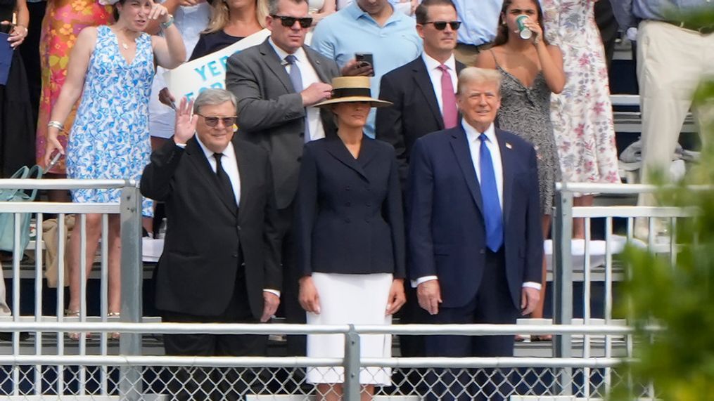 Republican presidential candidate former President Donald Trump, standing right with Melania Trump and her father, Viktor Knavs, attends a graduation ceremony for his son Barron at Oxbridge Academy Friday, May 17, 2024, in West Palm Beach, Fla. (AP Photo/Lynne Sladky)