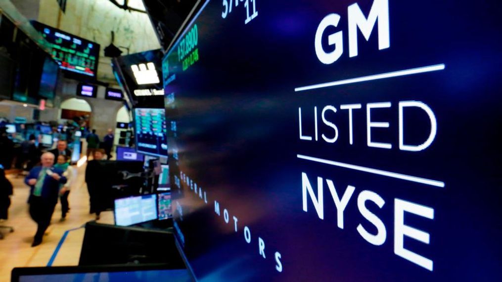 In this file photo, the logo for General Motors appears above a trading post on the floor of the New York Stock Exchange. General Motors reports earnings Wednesday, Oct. 31. (AP Photo/Richard Drew, File)