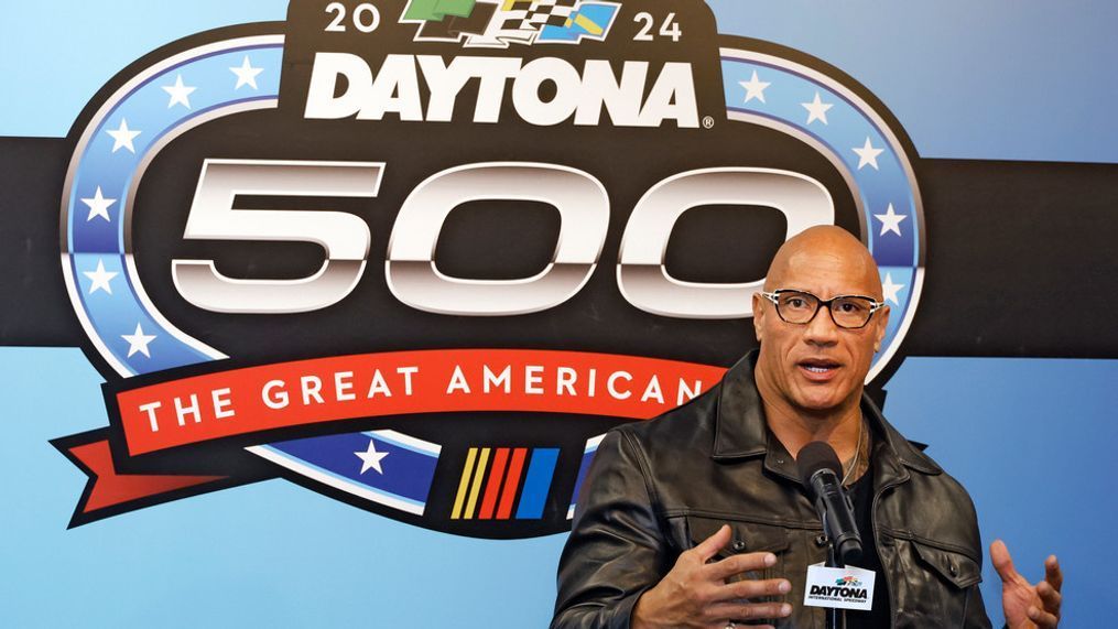 Race Grand Marshal Dwayne "The Rock" Johnson gestures during a news conference after the NASCAR Daytona 500 auto race was postponed by rain Sunday, Feb. 18, 2024, at Daytona International Speedway in Daytona Beach, Fla. (AP Photo/Terry Renna)