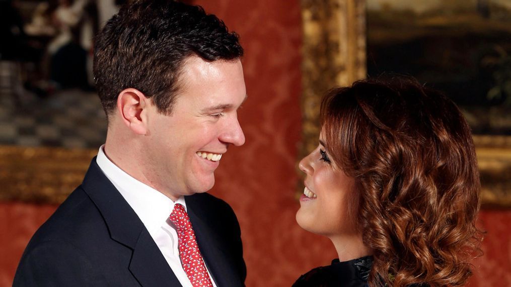 FILE – Britain's Princess Eugenie and Jack Brooksbank pose for the media in the Picture Gallery at Buckingham Palace after they announced their engagement in London, Monday, Jan. 22, 2018. (Jonathan Brady/Pool Photo via AP)